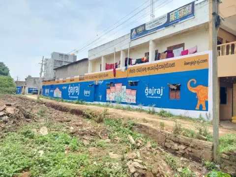 Long stretch of Gajraj wall painting along a road
